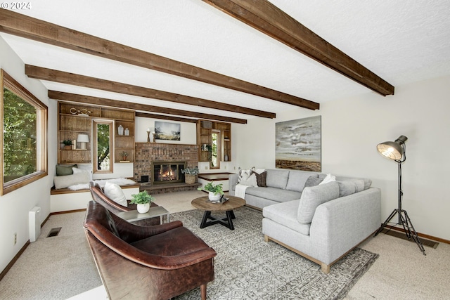 living room with light colored carpet, a fireplace, a textured ceiling, and beamed ceiling