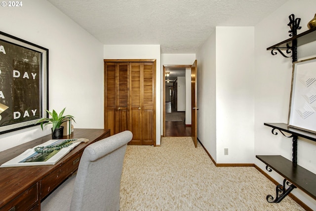 carpeted office with a textured ceiling