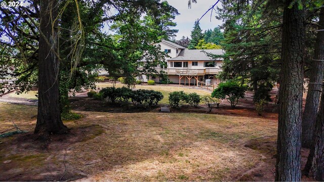 view of yard with a wooden deck