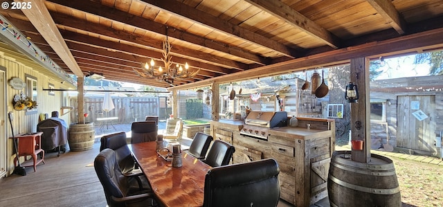 sunroom / solarium featuring beamed ceiling, wooden ceiling, and a chandelier