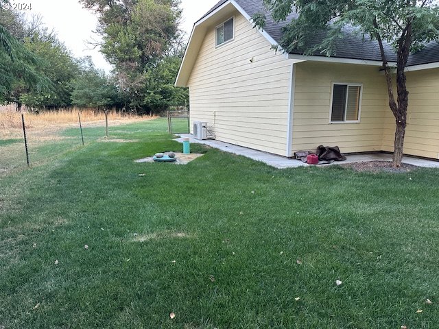 view of home's exterior featuring a lawn