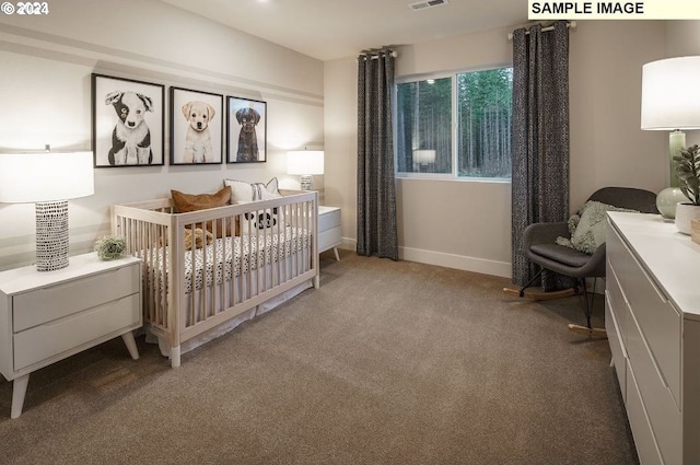 bedroom featuring light colored carpet and a nursery area