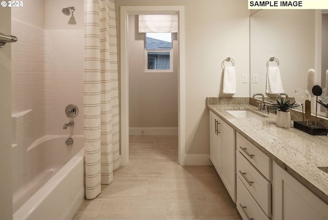 bathroom with vanity and shower / tub combo with curtain