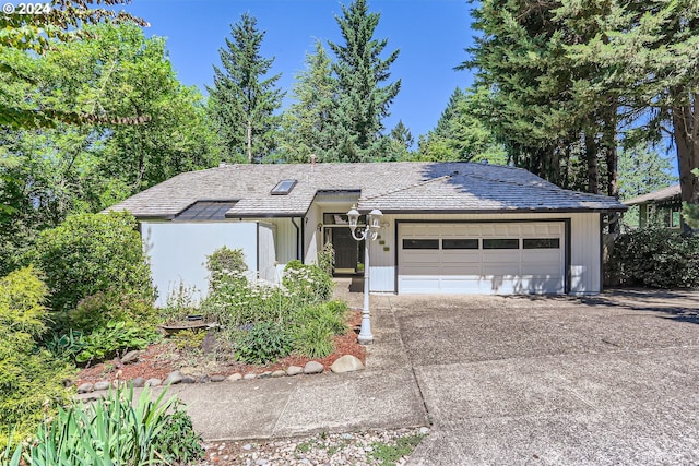 ranch-style house featuring a garage