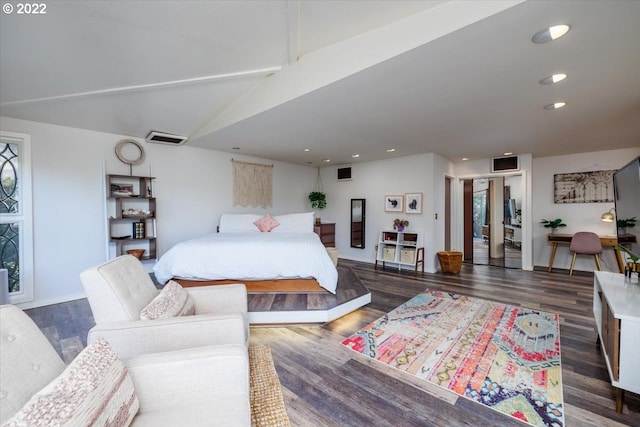 bedroom with lofted ceiling with beams and dark hardwood / wood-style flooring