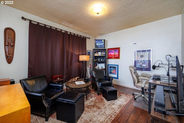 office featuring hardwood / wood-style flooring and a textured ceiling