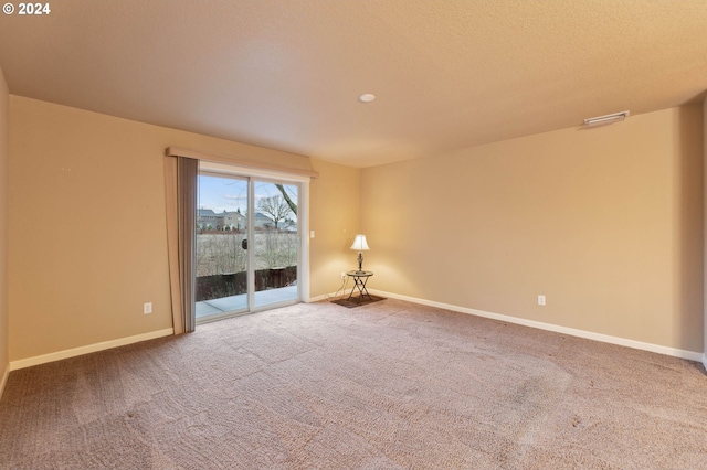 empty room featuring carpet flooring