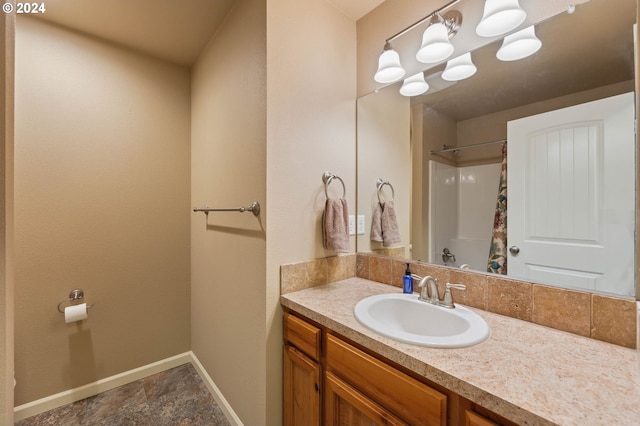 bathroom with vanity and walk in shower