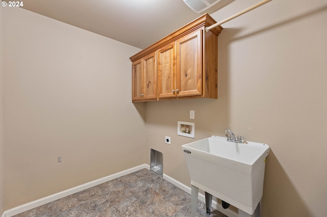 laundry room featuring electric dryer hookup, cabinets, sink, and washer hookup