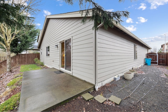 view of home's exterior with a patio