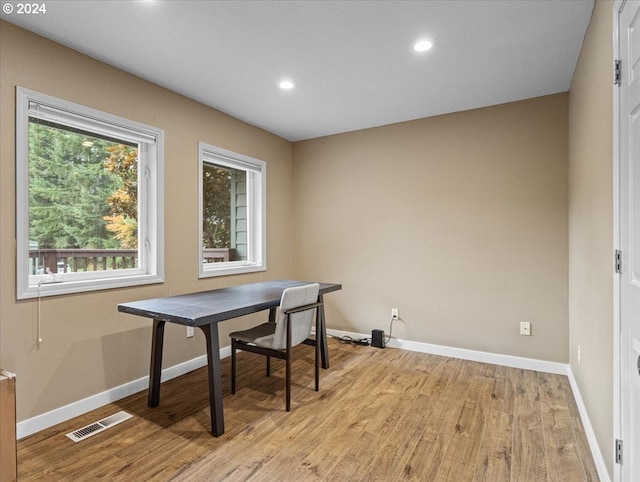 dining area featuring light wood-type flooring