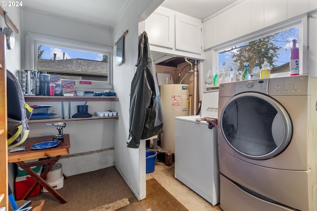 laundry room featuring separate washer and dryer, plenty of natural light, and water heater