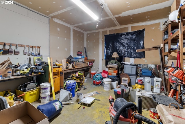 misc room featuring a workshop area and concrete flooring