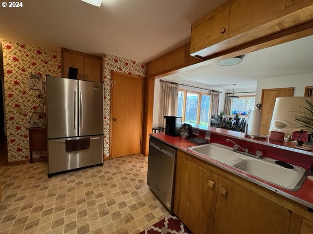 kitchen with appliances with stainless steel finishes and sink