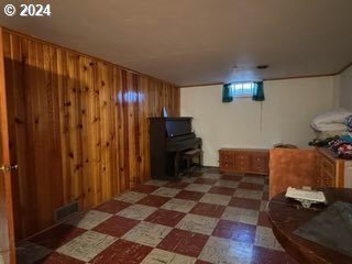 basement with wood walls