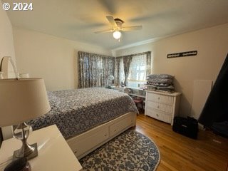 bedroom featuring wood-type flooring and ceiling fan