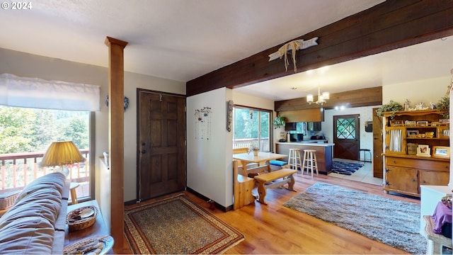 living room featuring light hardwood / wood-style flooring and a chandelier