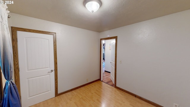 unfurnished room featuring light wood-type flooring