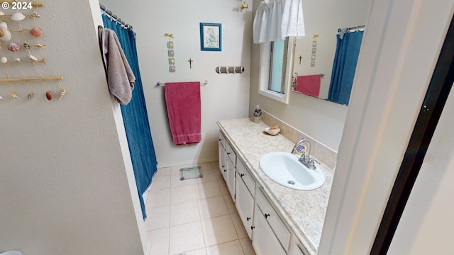 bathroom featuring tile patterned flooring and vanity