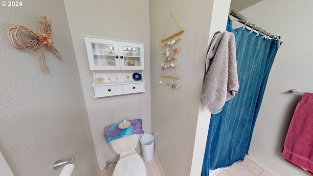 bathroom with tile patterned flooring