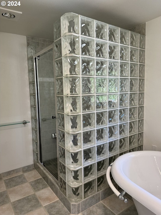 bathroom featuring separate shower and tub