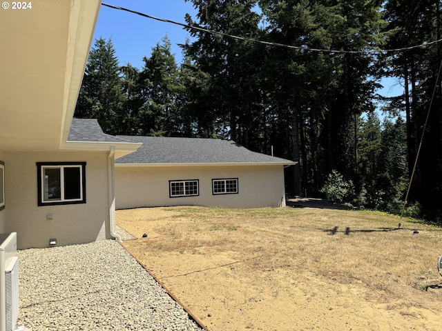 view of side of home with a patio