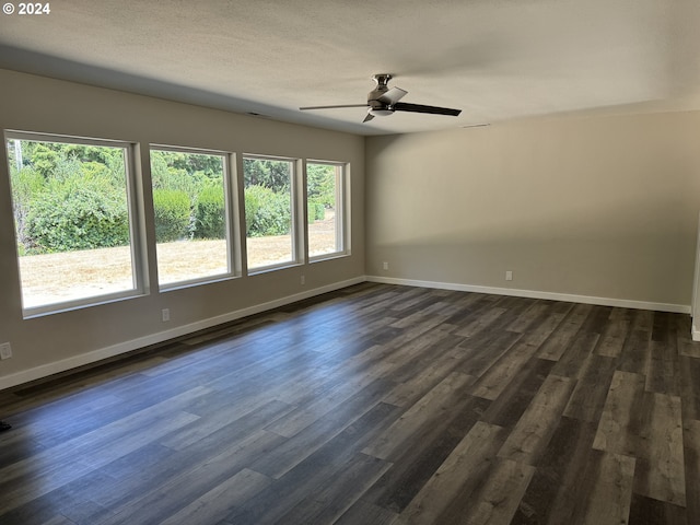 spare room featuring a textured ceiling, dark hardwood / wood-style flooring, and ceiling fan