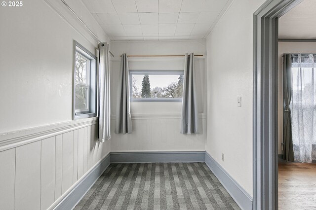 bedroom with light wood-type flooring and ornamental molding