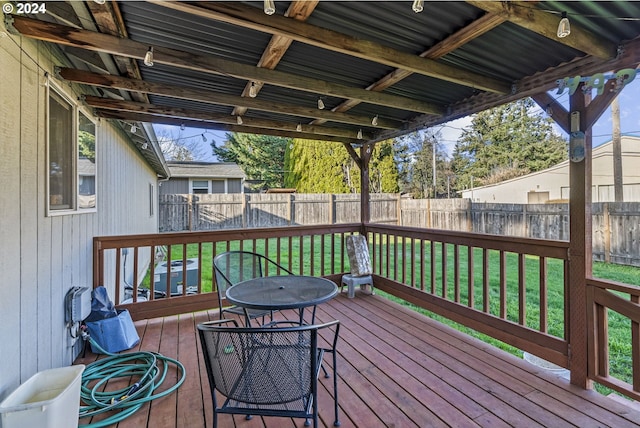 wooden deck featuring cooling unit and a yard