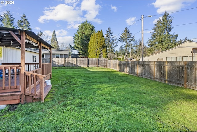 view of yard featuring a wooden deck