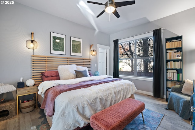 bedroom featuring light hardwood / wood-style flooring and ceiling fan