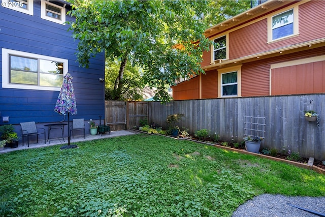 215 NE 30th Ave, Portland, OR 97232 - fenced backyard featuring a patio