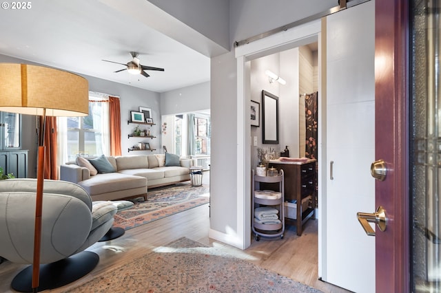 215 NE 30th Ave, Portland, OR 97232 - living area with plenty of natural light, wood finished floors, and a ceiling fan