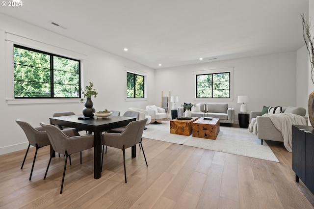 dining space featuring light wood-style flooring, visible vents, baseboards, and recessed lighting