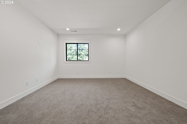 unfurnished room featuring recessed lighting, carpet, and baseboards