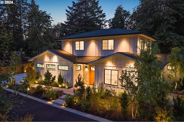 view of front facade featuring a standing seam roof, metal roof, and board and batten siding