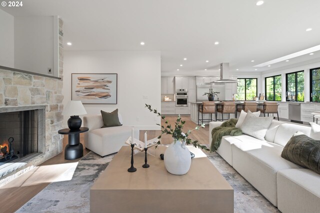 living room featuring a fireplace and light hardwood / wood-style floors