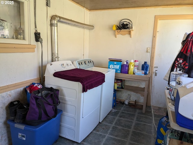 clothes washing area with washer and clothes dryer