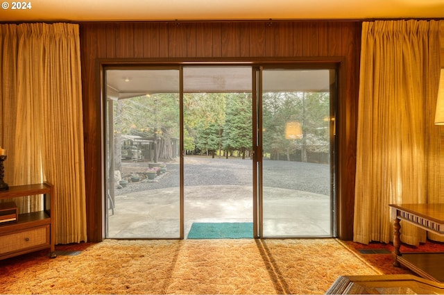 entryway with plenty of natural light and light colored carpet