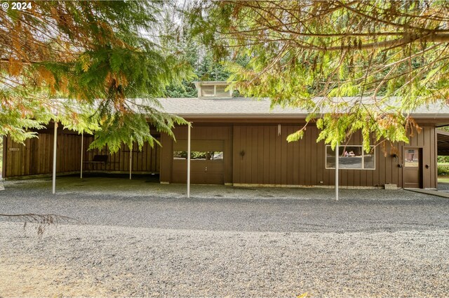 rear view of house with a carport