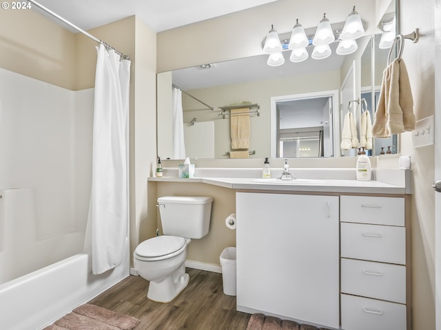 full bathroom featuring shower / bathtub combination with curtain, wood-type flooring, vanity, and toilet