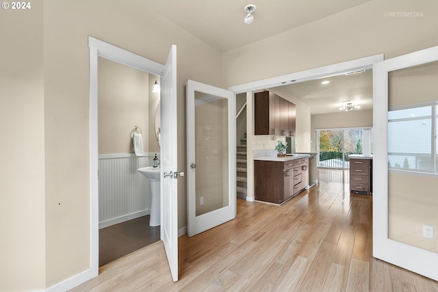 bathroom featuring wood-type flooring and french doors