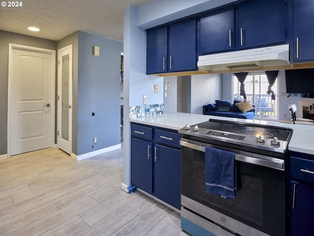 kitchen featuring stainless steel range with electric stovetop, light hardwood / wood-style floors, and blue cabinets