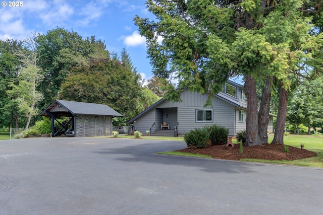 view of front of home featuring a carport