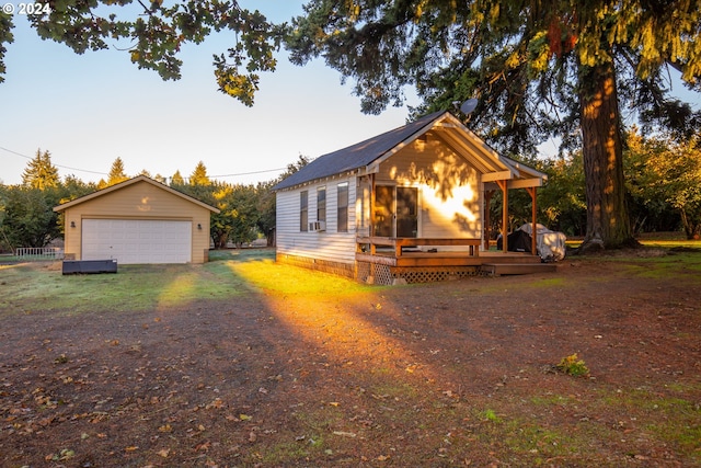 view of front of home featuring an outdoor structure and a garage