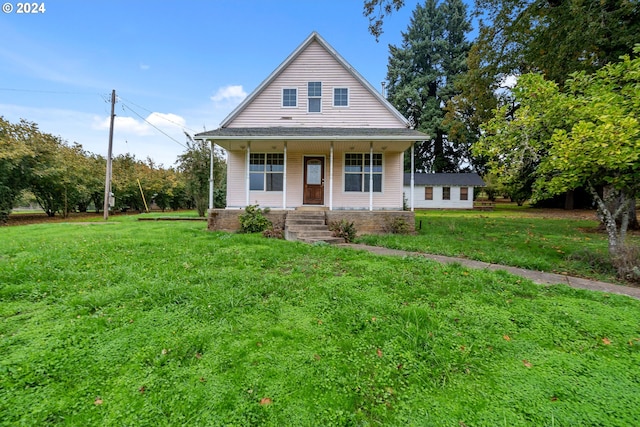 view of front facade featuring a front lawn and covered porch