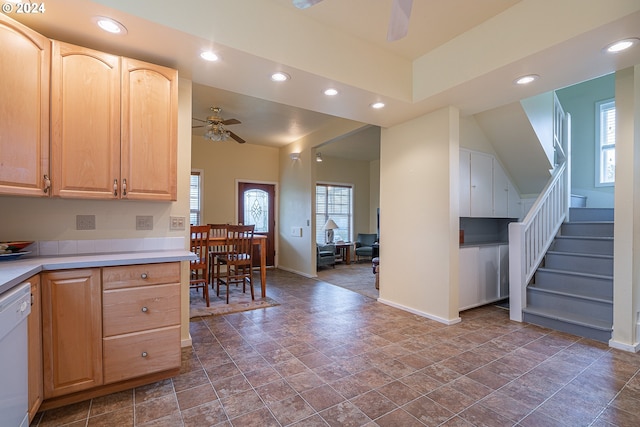 kitchen featuring white dishwasher, ceiling fan, light brown cabinetry, and plenty of natural light