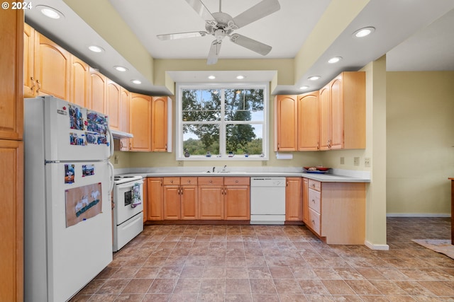 kitchen with ceiling fan, light brown cabinets, sink, and white appliances