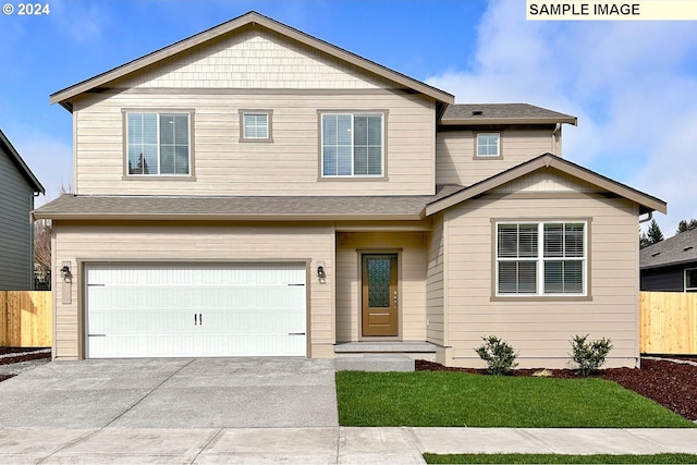 view of front facade with a garage and a front lawn