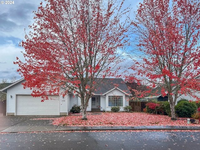 ranch-style house featuring a garage